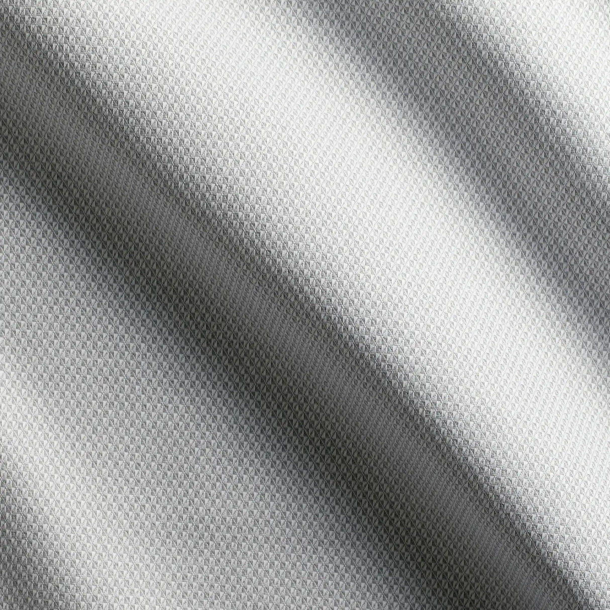 Detailaufnahme des grauen Stoffes - hochwertiger langlebiger Stoff für elegante Tischgestaltung