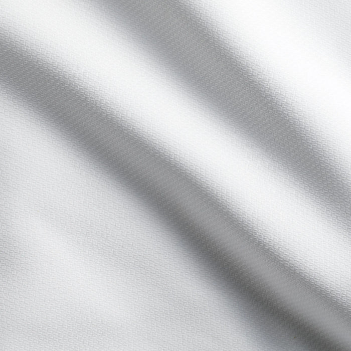 Detailaufnahme des weißen Stoffs - langlebige, pflegeleichte Tischwäsche für gehobene Gastronomie